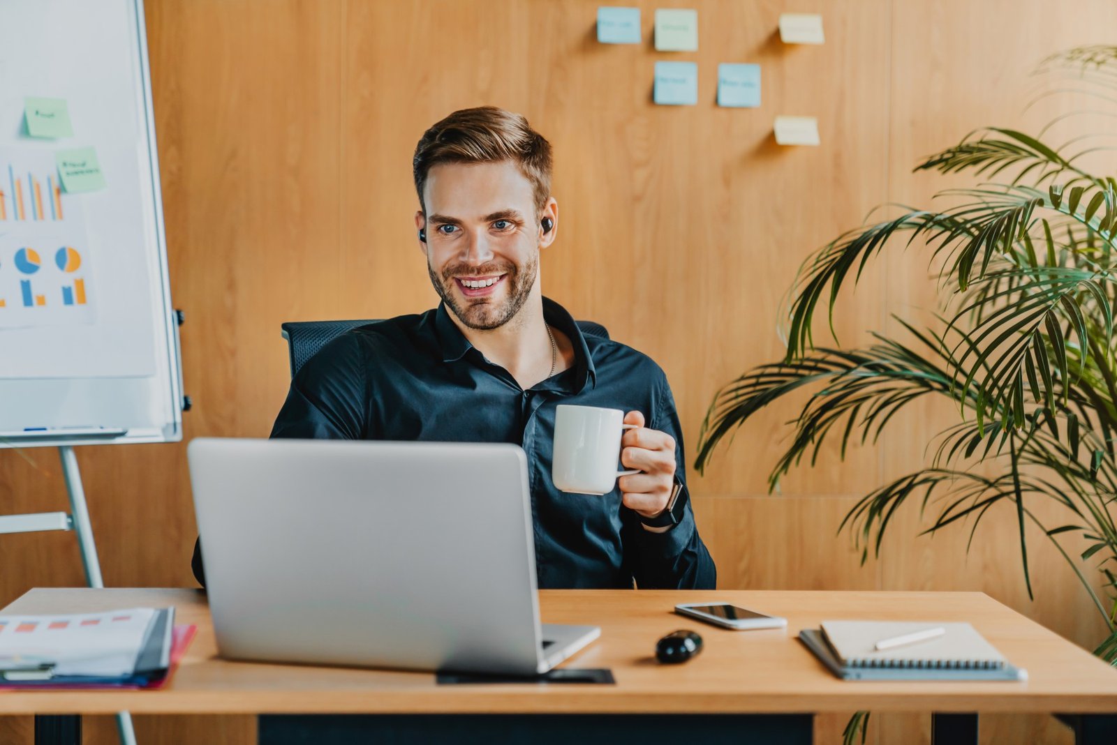 Home cheerful caucasian man working with laptop and wir 2023 11 27 04 46 23 utc 1 1.jpg