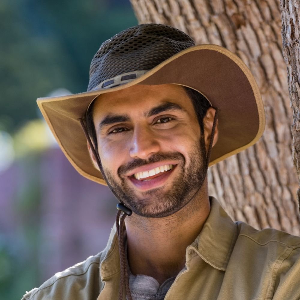Home smiling man standing with arms crossed near tree t d8p8b96 1 1 1.jpg